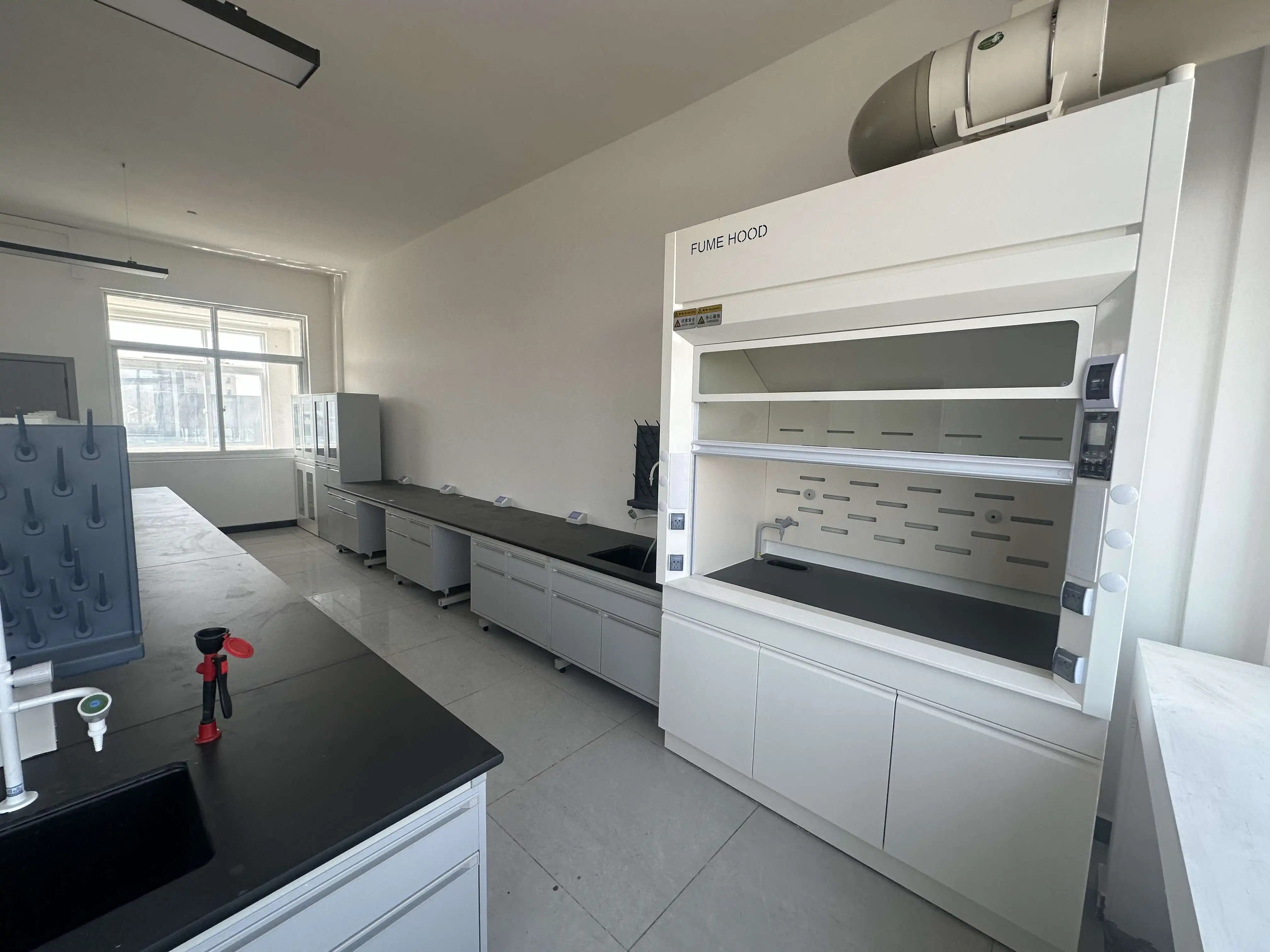 Can polypropylene fume hoods resist corrosive chemicals?